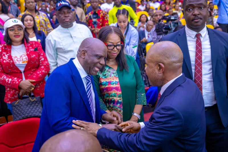 Governor Peter Mba exchanging greetings with another prominent son of the State former Minister Barth Nnaii